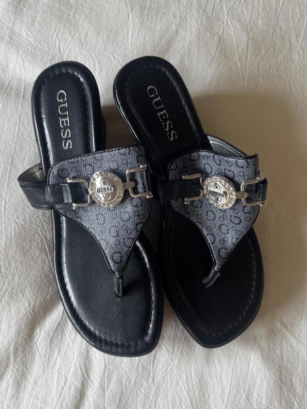 GUESS Black and Gray Logo Thong Sandals with Silver Medallions